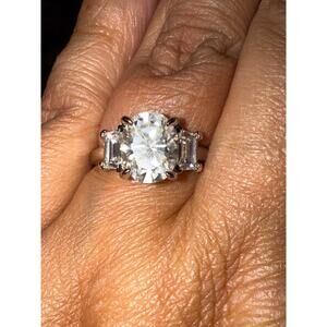 3CT oval moissanite with side baguettes